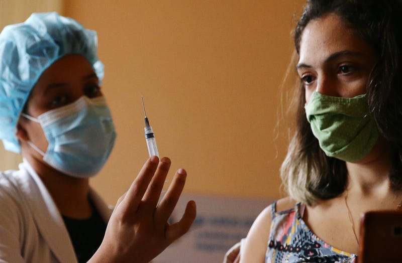 Nurse-in-training Julia Ramos displays the empty syringe after vaccinating a person at a COVID-19 vaccination clinic at Museu da Republica (Museum of the Republic) on May 24, 2021 in Rio de Janeiro, Brazil.