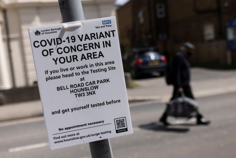 A sign directing people to a nearby vaccination centre is displayed on May 27, 2021 in Hounslow, England.
