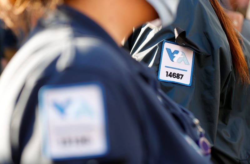 A Santa Clara Valley Transportation Authority (VTA) worker wears a black ribbon on her uniform during a vigil at San Jose City Hall for the 9 victims of a shooting at the Santa Clara Valley Transportation Authority (VTA) light rail yard on May 27, 2021 in San Jose, California.