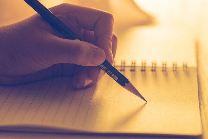 writing in a notebook