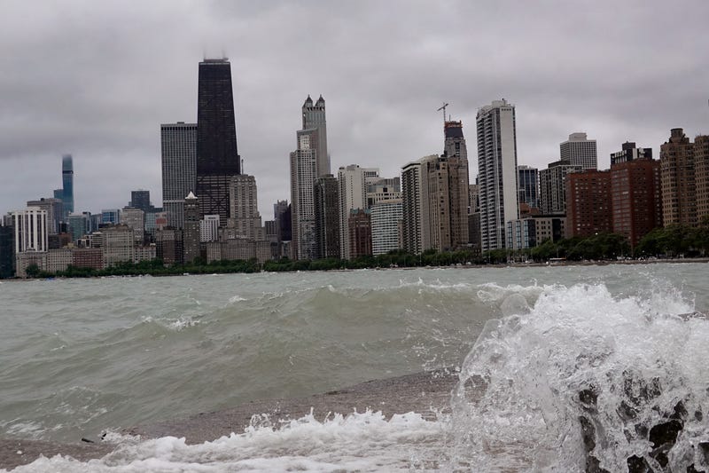 wave crashes into a break wall