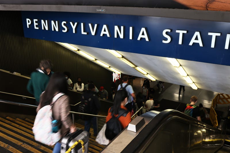 People enter Penn Station on Seventh Avenue in Midtown