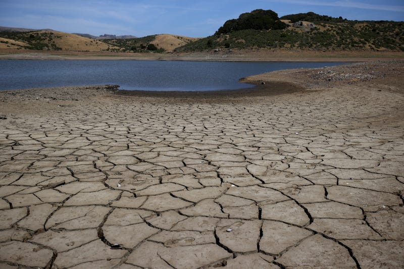 Dry cracked earth is visible as water levels are low at Nicasio Reservoir on May 28, 2021 in Nicasio, California.