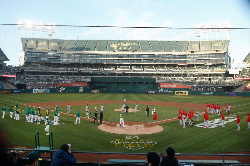 Oakland Athletics and Los Angeles Angels players come onto the field after Mark Canha #20 of the Oakland Athletics was nearly hit by a pitch from Shohei Ohtani #17 of the Los Angeles Angels in the bottom of the third inning at RingCentral Coliseum on May 28, 2021 in Oakland, California.