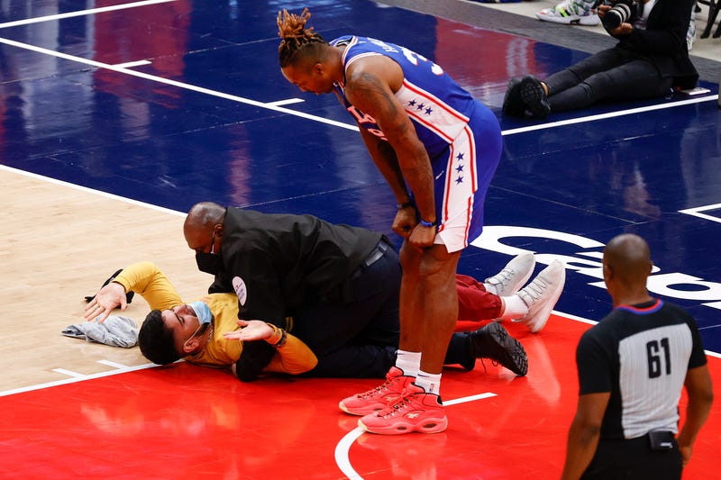 WASHINGTON, DC - MAY 31: Dwight Howard #39 of the Philadelphia 76ers looks down at a fan who ran onto the court and was tackled by security in the third quarter of Game Four of the Eastern Conference first round series against the Washington Wizards at Capital One Arena on May 31, 2021 in Washington, DC.