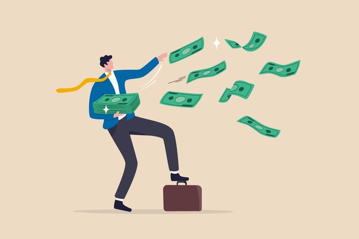 happy businessman millionaire throw out pile of money banknotes flying into the air.