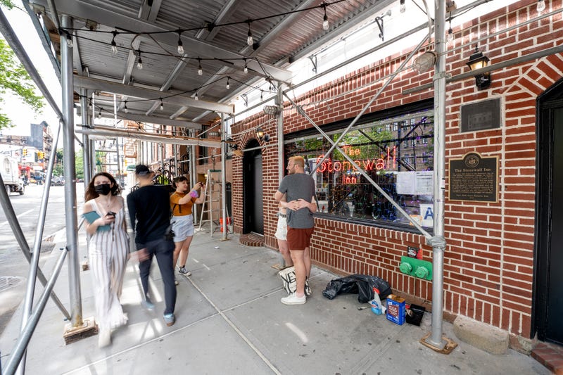 A couple takes a photo in front of the Stonewall Inn on June 02, 2021 in New York City. The Stonewall Inn was the site of the 1969 Stonewall Riots which are considered the spark of the gay liberation movement and the contemporary LGBTQ movement in the United States. 