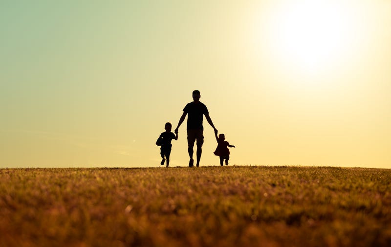 Picture of adult with two children