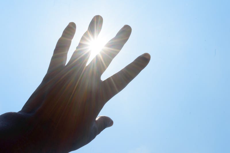 hand over sun