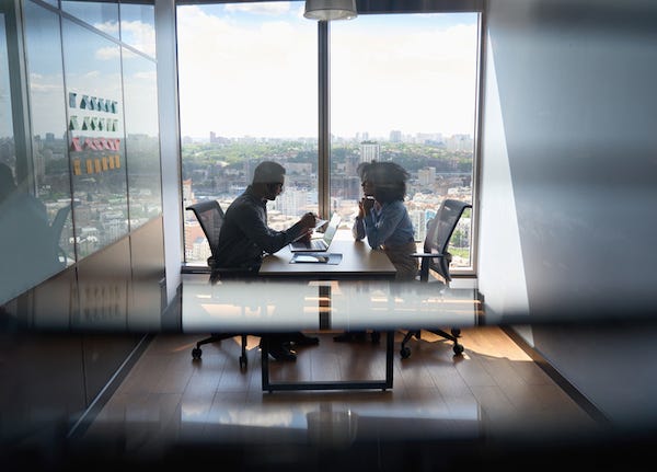 Man and woman having meeting in office
