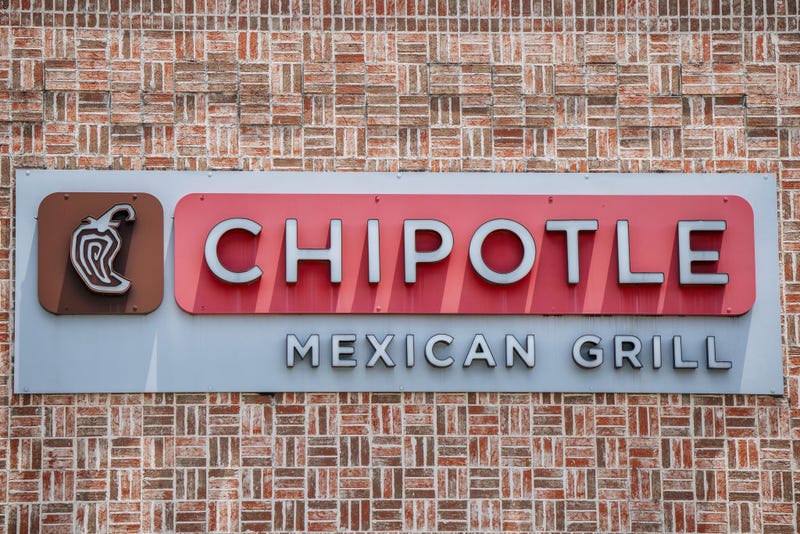 A Chipotle Mexican Grill sign is shown on June 09, 2021 in Houston, Texas. Menu prices at the Chipotle Mexican Grill have risen by roughly 4% to cover the costs of raising its' minimum wage to $15 an hour for employees.