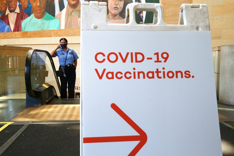 A sign points to a vaccination site at Los Angeles' Union Station in an effort to target commuters.