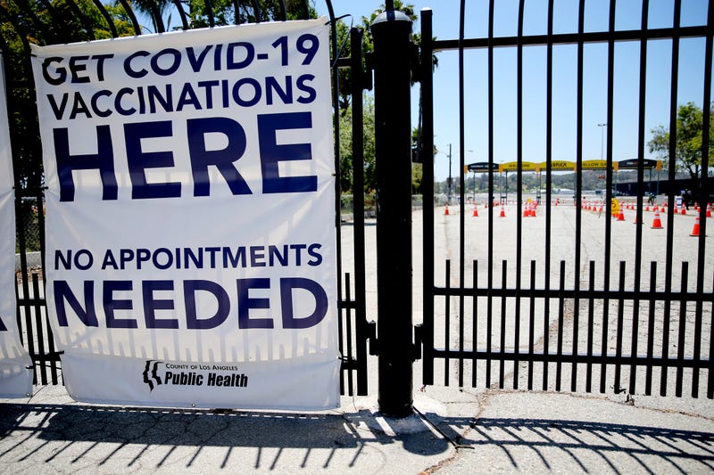 A sign promotes a nearly empty mass vaccination site at the Pomona Fairplex on June 10, 2021 in Pomona, California.