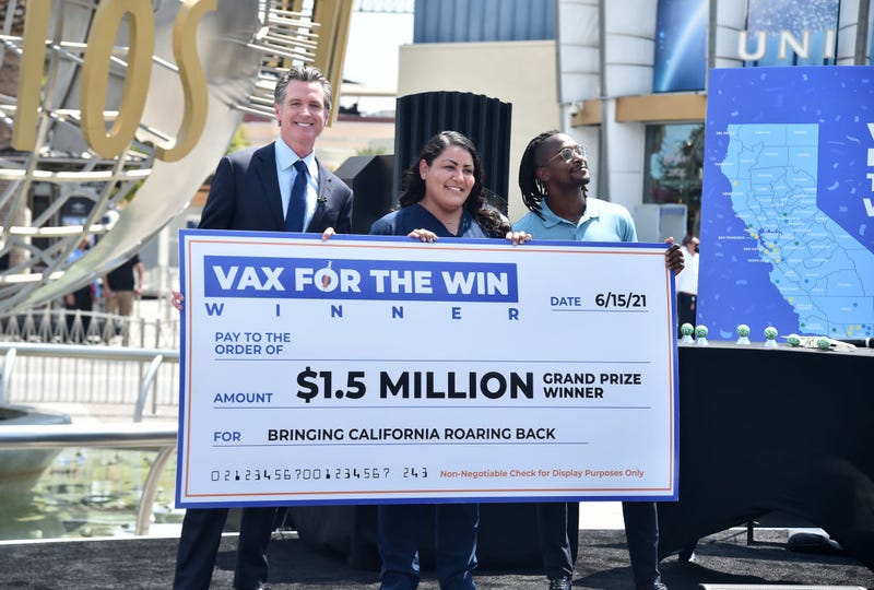 California Governor Gavin Newsom, Scott Evans and First responder and Califronia's first person to be vaccinated, Helen Cordova attend California Governor Gavin Newsom's press conference for the official reopening of the state of California at Universal Studios Hollywood on June 15, 2021 in Universal City, California. (Photo by Alberto E. Rodriguez/Getty Images)