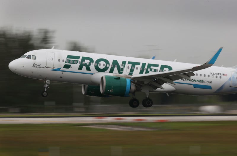 A Frontier airlines plane lands at the Miami International Airport on June 16, 2021 in Miami, Florida.