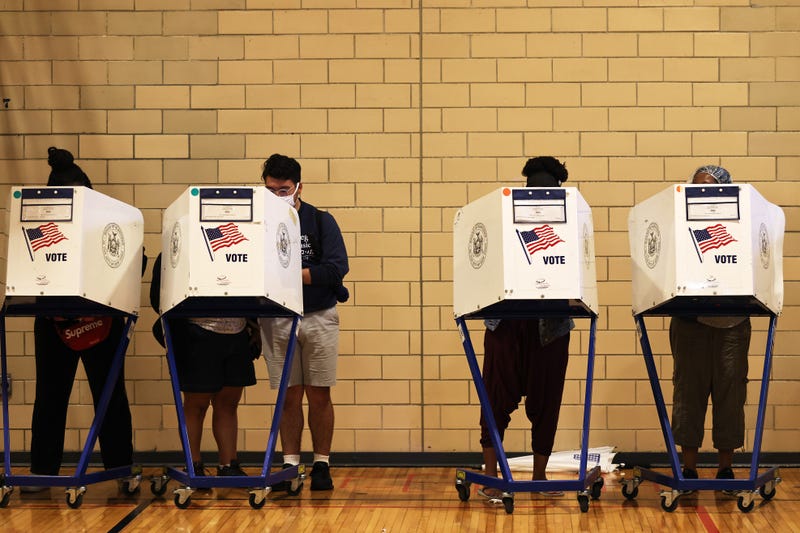 Voters at ballot boxes in Brooklyn last June