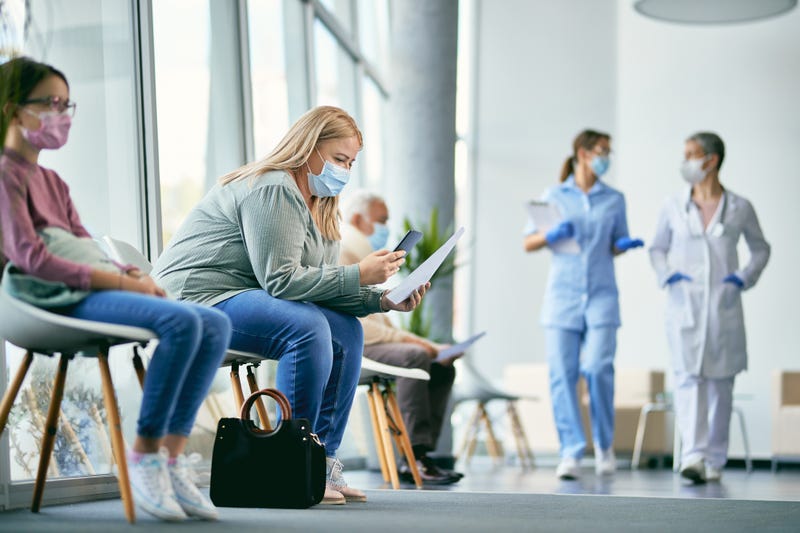 People wearing masks in a medical facility 