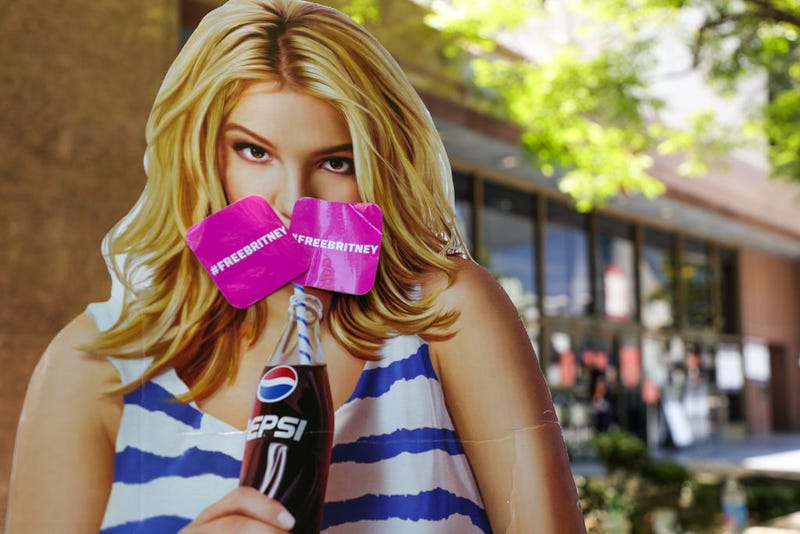 A cardboard cutout depicting Britney Spears is seen during a #FreeBritney protest at Los Angeles Grand Park during a conservatorship hearing for Spears on June 23, 2021 in Los Angeles, California. Spears is expected to address the court remotely. Spears was placed in a conservatorship managed by her father, Jamie Spears, and an attorney, which controls her assets and business dealings, following her involuntary hospitalization for mental care in 2008. (Photo by Rich Fury/Getty Images)
