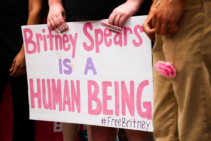 #FreeBritney activists protest at Los Angeles Grand Park during a conservatorship hearing for Britney Spears on June 23, 2021 in Los Angeles, California. Spears was placed in a conservatorship managed by her father, Jamie Spears, and an attorney, which controls her assets and business dealings, following her involuntary hospitalization for mental care in 2008.