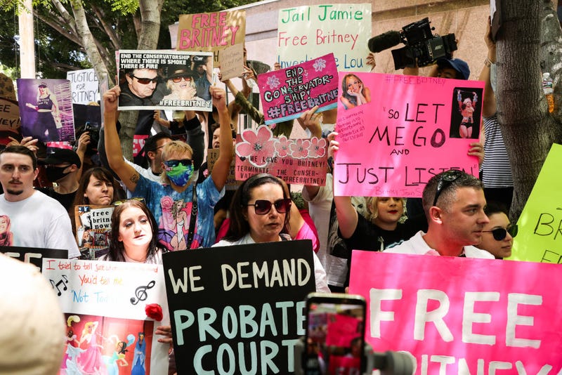 #FreeBritney activists protest at Los Angeles Grand Park during a conservatorship hearing for Britney Spears on June 23, 2021, in Los Angeles, California. Spears was placed in a conservatorship managed by her father, Jamie Spears, and an attorney, which controls her assets and business dealings, following her involuntary hospitalization for mental care in 2008. 