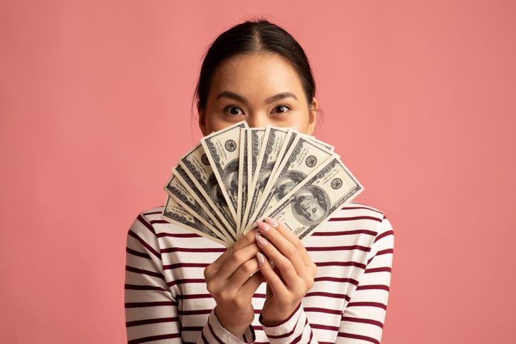 Woman holding money
