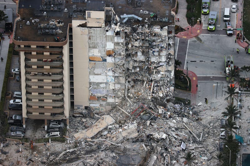 Search and Rescue personnel work after the partial collapse of the 12-story Champlain Towers South