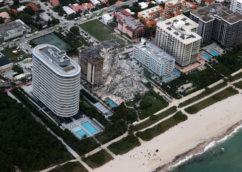 In this aerial view, search and rescue personnel work after the partial collapse of the 12-story Champlain Towers South condo building on June 24, 2021 in Surfside, Florida. It is unknown at this time how many people were injured as search-and-rescue effort continues with rescue crews from across Miami-Dade and Broward counties. (Photo by Joe Raedle/Getty Images)