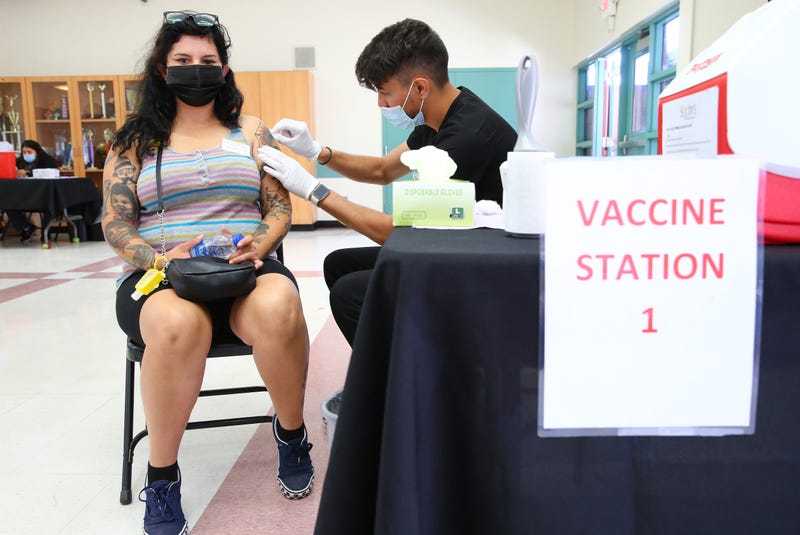 Wendy Ibarra prepares to receive her second COVID-19 vaccination dose at a vaccination clinic in South Los Angeles on June 25, 2021 in Los Angeles, California.