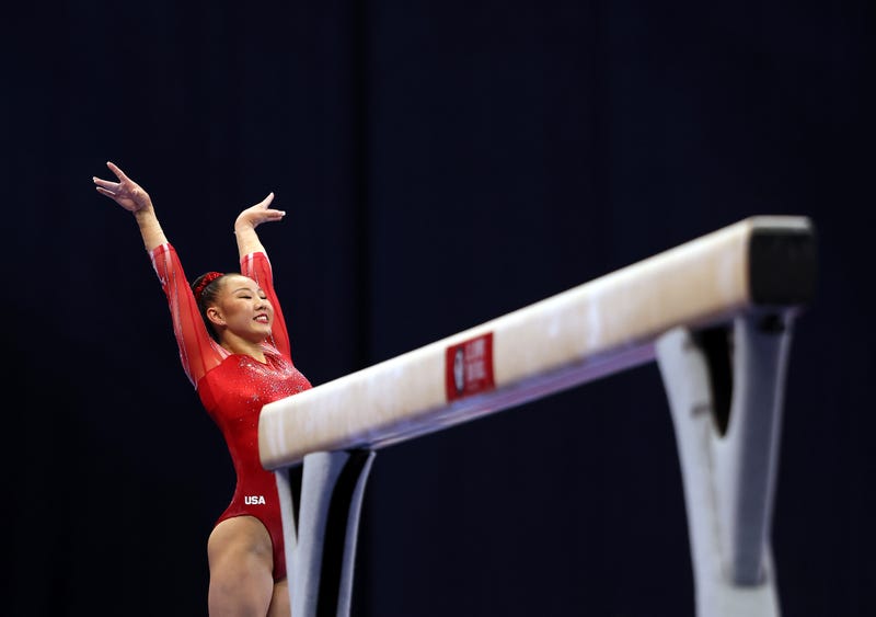 Kara Eaker smiles after landing her dismount off the balance beam during the Women's competition of the 2021 U.S. Gymnastics Olympic 