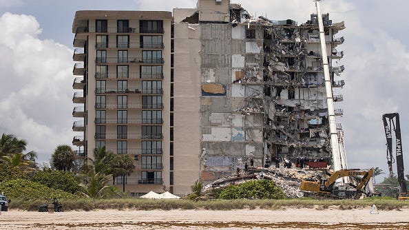 PHOTOS: Miami condo collapse site is now a 'mostly cleared' pit, mounds of debris gone