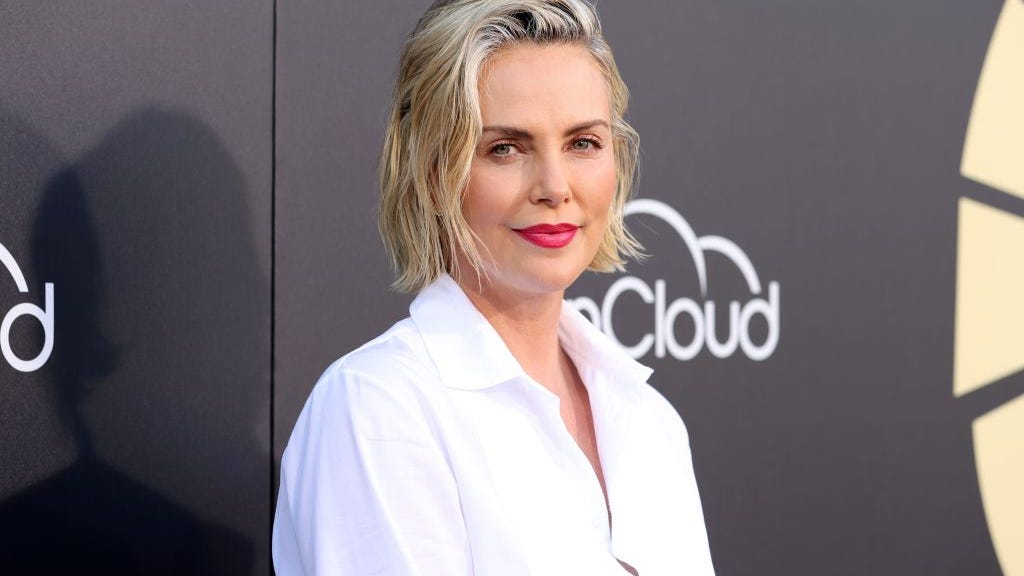 Charlize Theron rocks '80s outfit for prom-themed 46th birthday party