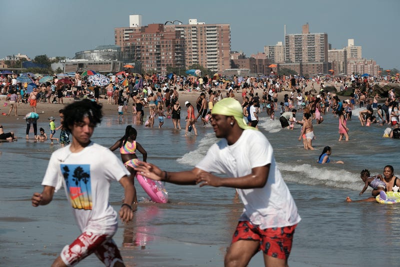 People cool off at Coney Island beach in Brooklyn on one of the first hot days of the year on June 28, 2021 in New York City