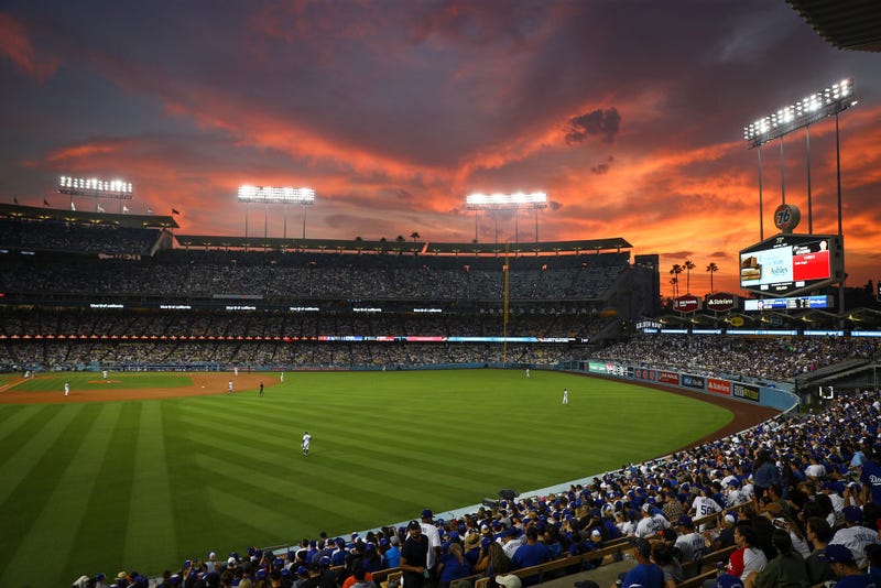 The sun sets over Dodger Stadium during the game between the Los Angeles Dodgers and the San Francisco Giants on June 28, 2021 in Los Angeles, California.