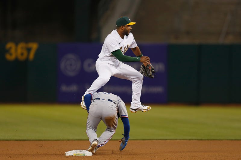 Elvis Andrus #17 of the Oakland Athletics got the force out on Isiah Kiner-Falefa #9 of the Texas Rangers at second base but was unable to complete the double play in the top of the eighth inning at RingCentral Coliseum on June 29, 2021 in Oakland, California.