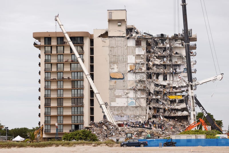 Search and rescue teams look for possible survivors and remains in the partially collapsed 12-story Champlain Towers South condo building on June 30, 2021 in Surfside, Florida.