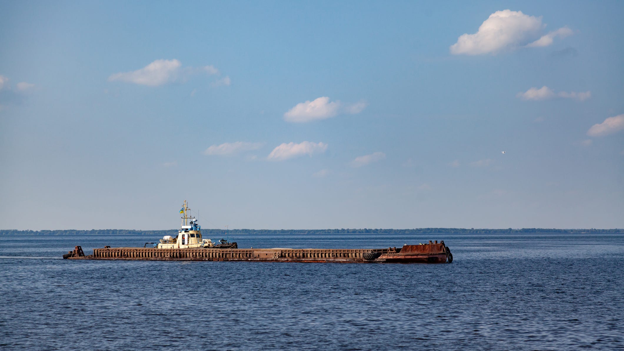 'The Great Lakes are not a dumping ground': Man charged with abandoning barge that sank, leaked oil into Lake Michigan