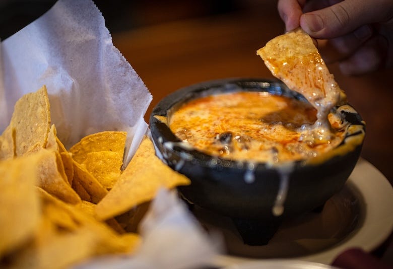 Chips and queso at a restaurant