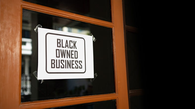 Black-owned business sign.