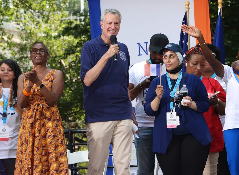 Mayor Bill de Blasio (R) and First Lady Chirlane McCray attend the "Hometown Heroes" Ticker Tape Parade on July 07, 2021 in New York City