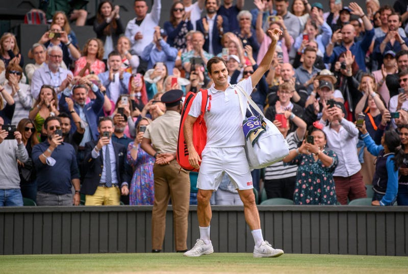 Roger Federer of Switzerland waves to the crowd after losing his men's Singles Quarter Final match against Hubert Hurkacz of Poland on Day Nine of The Championships - Wimbledon 2021 at All England Lawn Tennis and Croquet Club on July 07, 2021 in London, England.