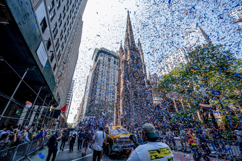 Confetti fills the sky during the "Hometown Heroes" ticker-tape parade on July 07, 2021
