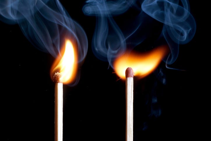 two lit matches in a file image