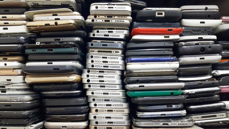 Used phones stacked on top of each other. 