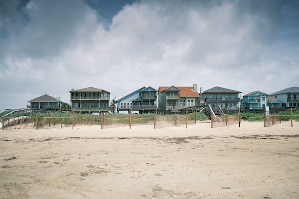 Row of beach houses along the coast of Galveston, TX