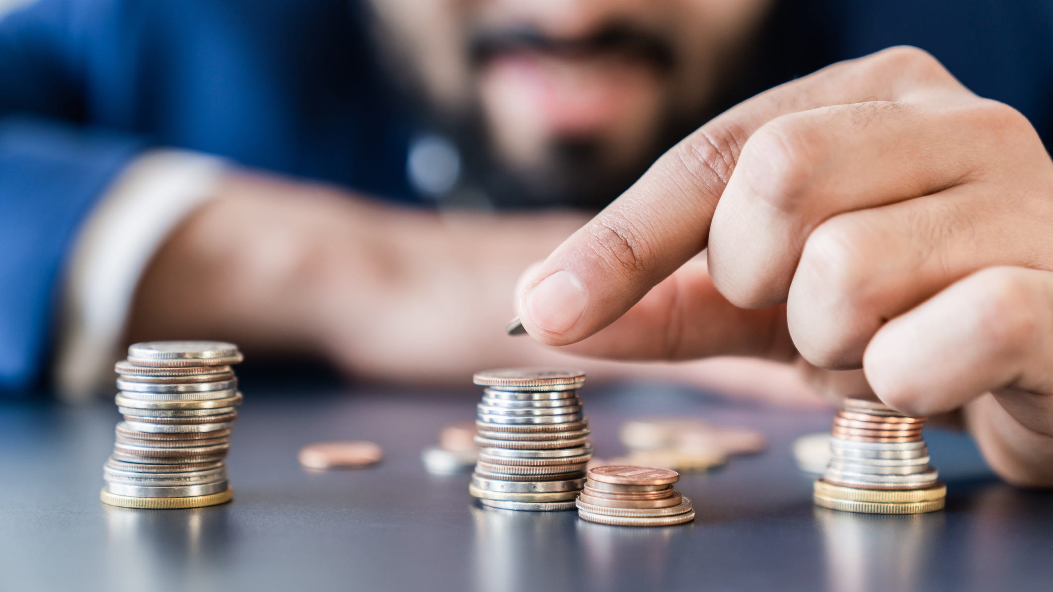 Fewer Americans are living paycheck-to-paycheck, survey says
