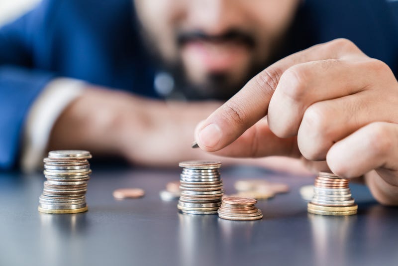 Person counting their money.