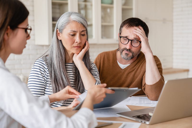 Financial advisor consulting a couple. 