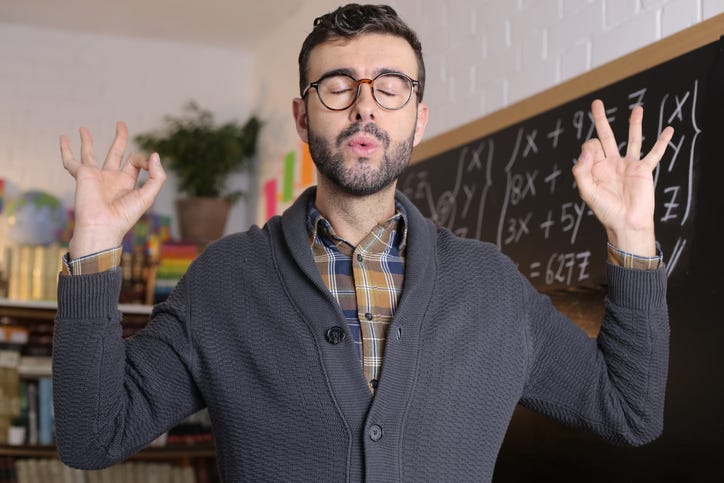 A young teacher attempting to calm himself down. 