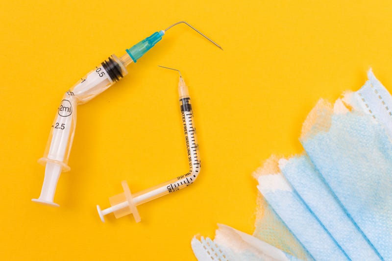 Bent syringes and ripped masks.