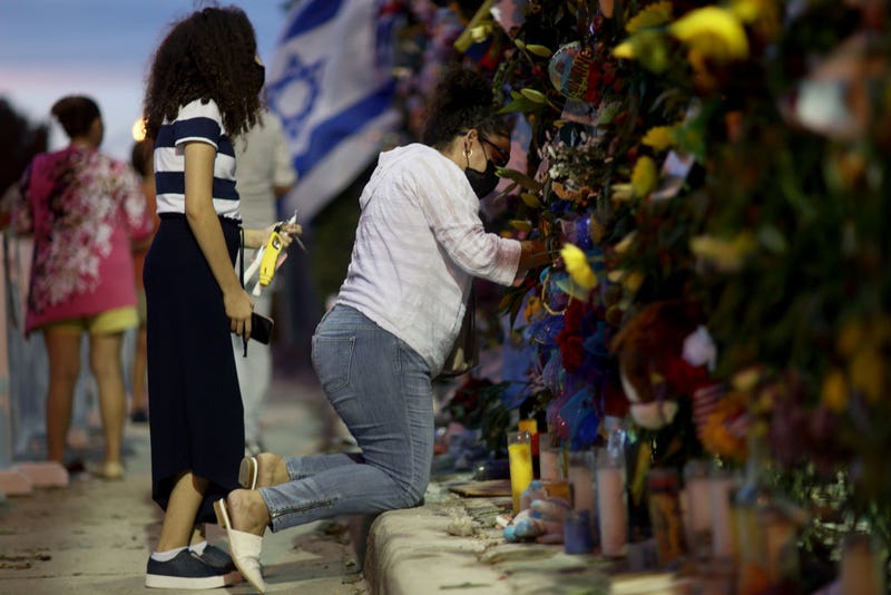Mourners visit the Surfside, Fla., condo collapse site on July 15.